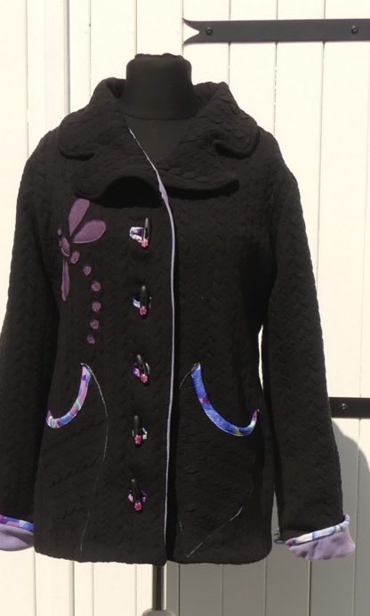 Veste en jersey matelassé noir doublée micro polaire mauve T 40